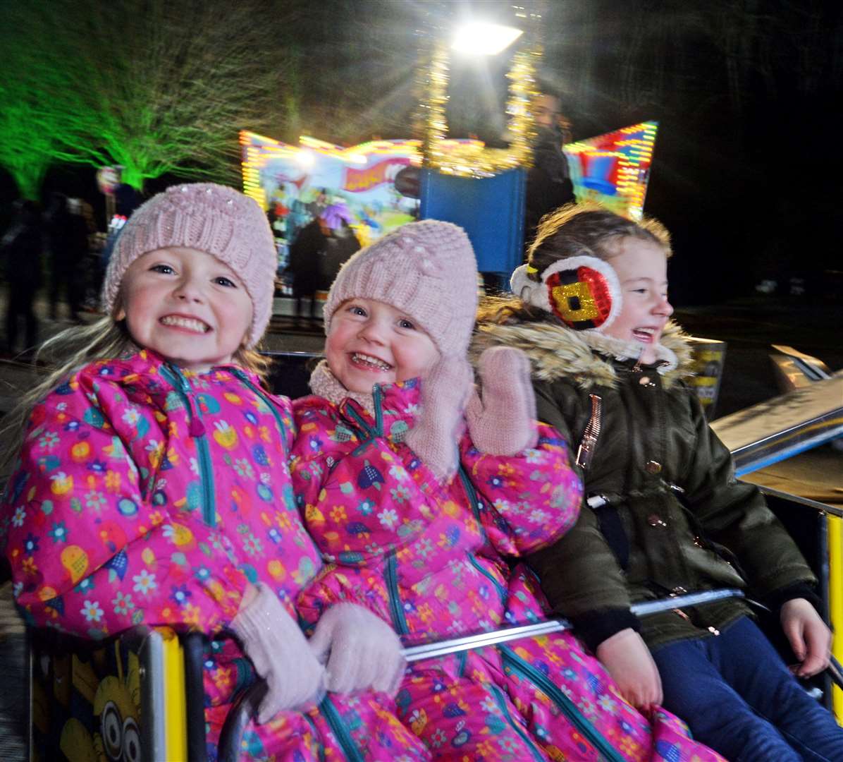 Merry on the merry go round (left to right) Phoebe Campbell, Rosie Campbell and Ava Hall. Picture: Gair Fraser.