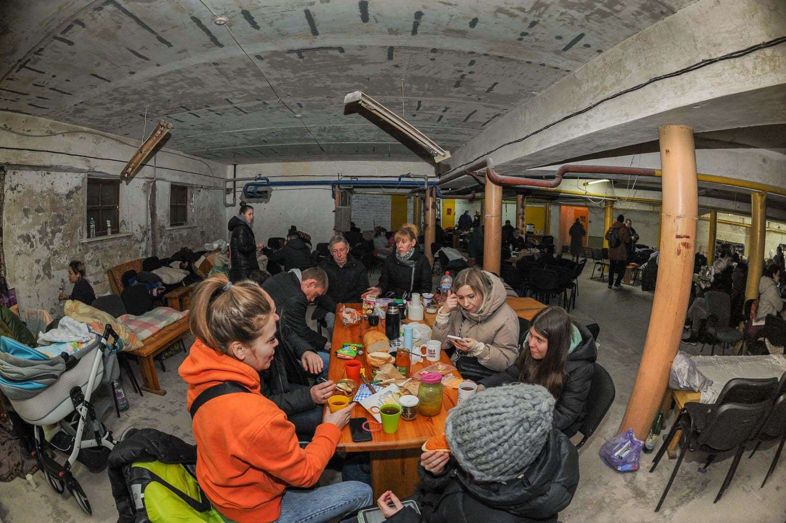 People sheltering in the basement of a church in Kherson.
