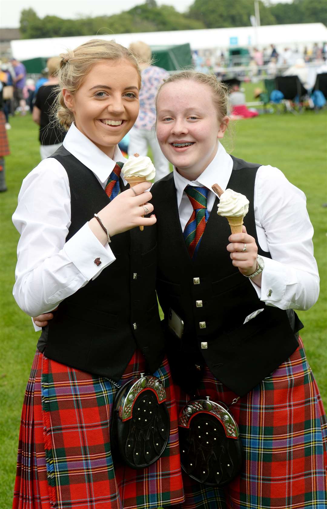 Ailsa Sutherland age 13 and Hollie Chalmers age 13 enjoy and ice cream, both from Turriff Pipe Band. Picture: Alasdair Allen