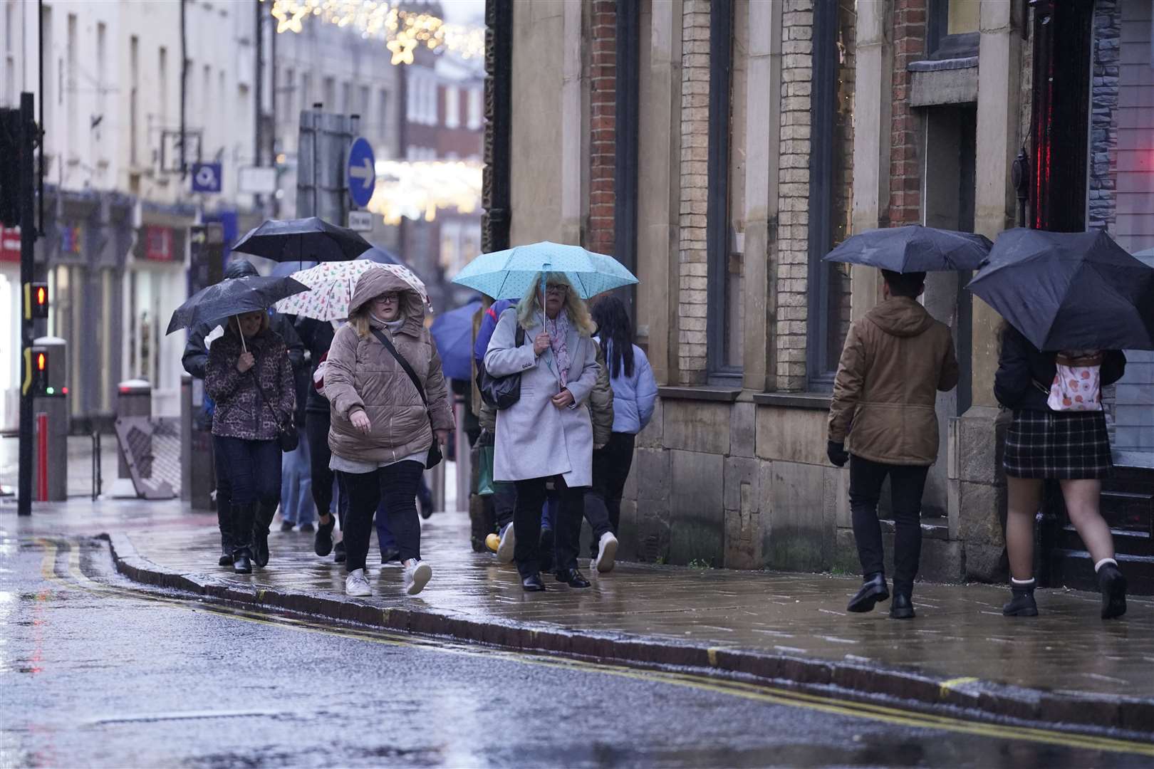 People walk in the rain in York (Danny Lawson/PA)