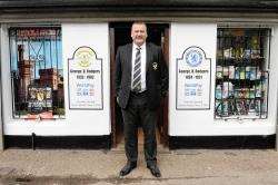 Clach chairman Alex Chisholm outside the Rodgers Newsagent in Grant Street, linking family ties with the Lilywhites and Chelsea.