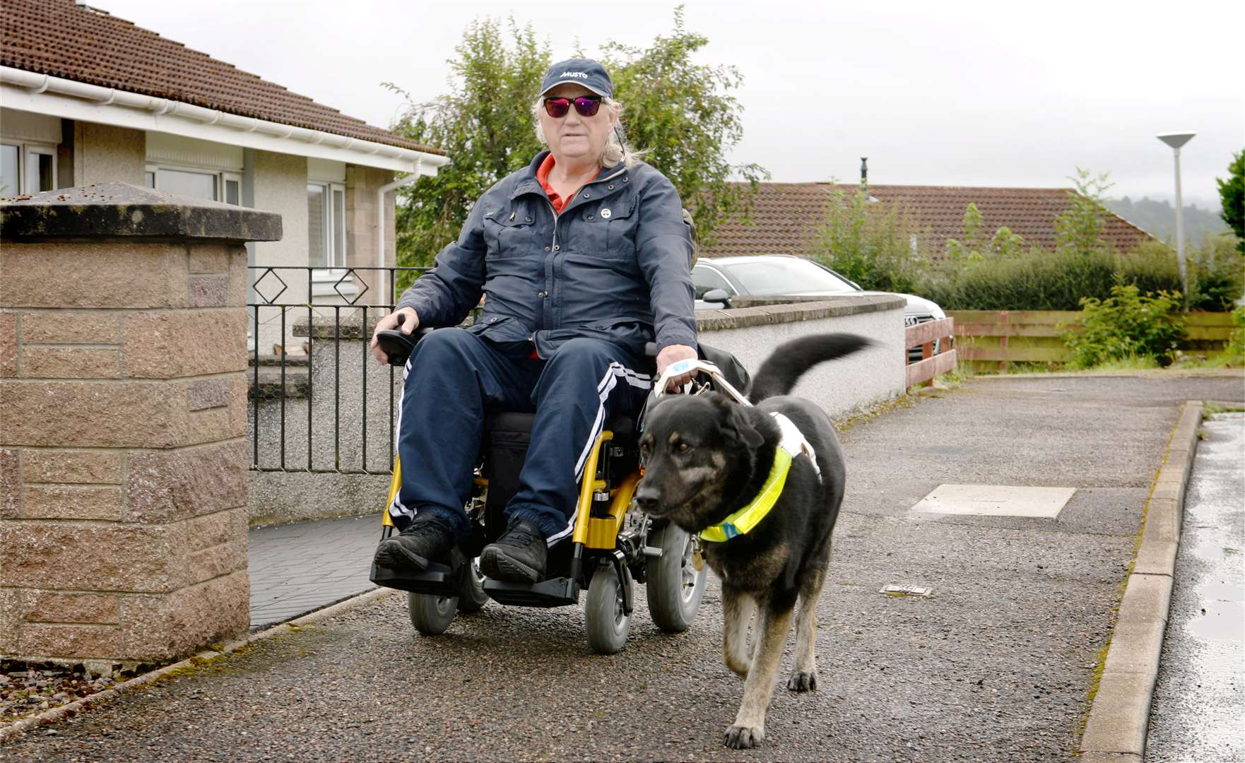 John Long's guide dog Freddie had to be retrained to lead his master's new wheelchair.
