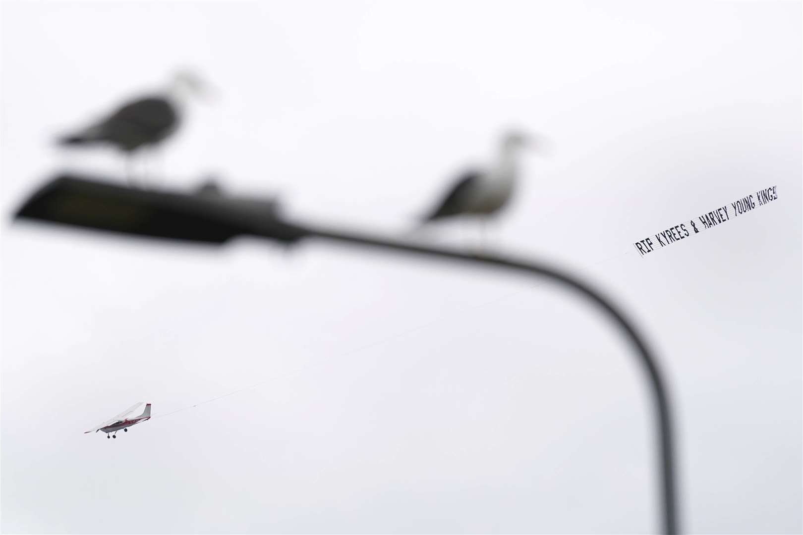 A plane pulls a banner before the funeral of Kyrees Sullivan and Harvey Evans (Jacob King/PA)