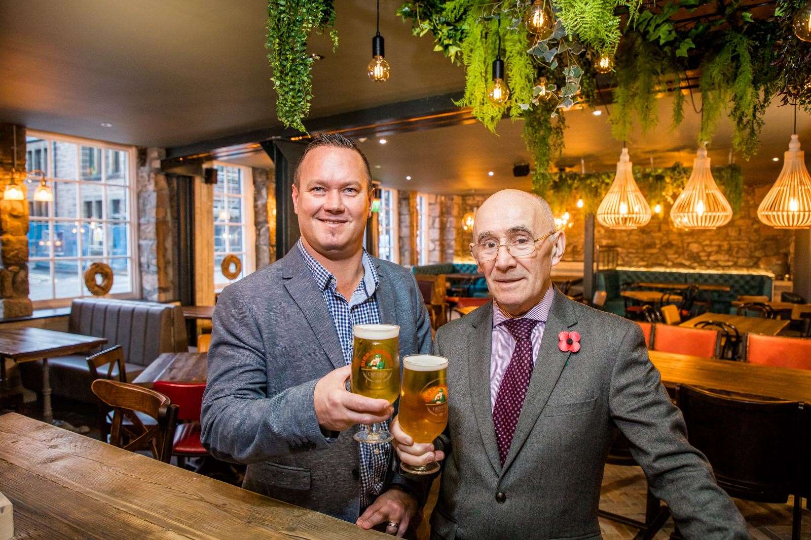 Licensee Billy McKechnie toasts the new pub with Highland councillor Jimmy Gray.