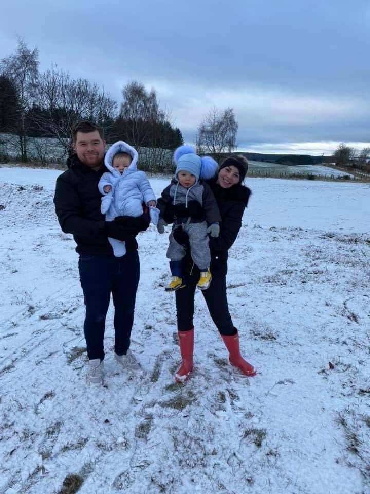 Enjoying the recent snowfall, Dad Shawn, Finley, Lyle and mum Ellie.