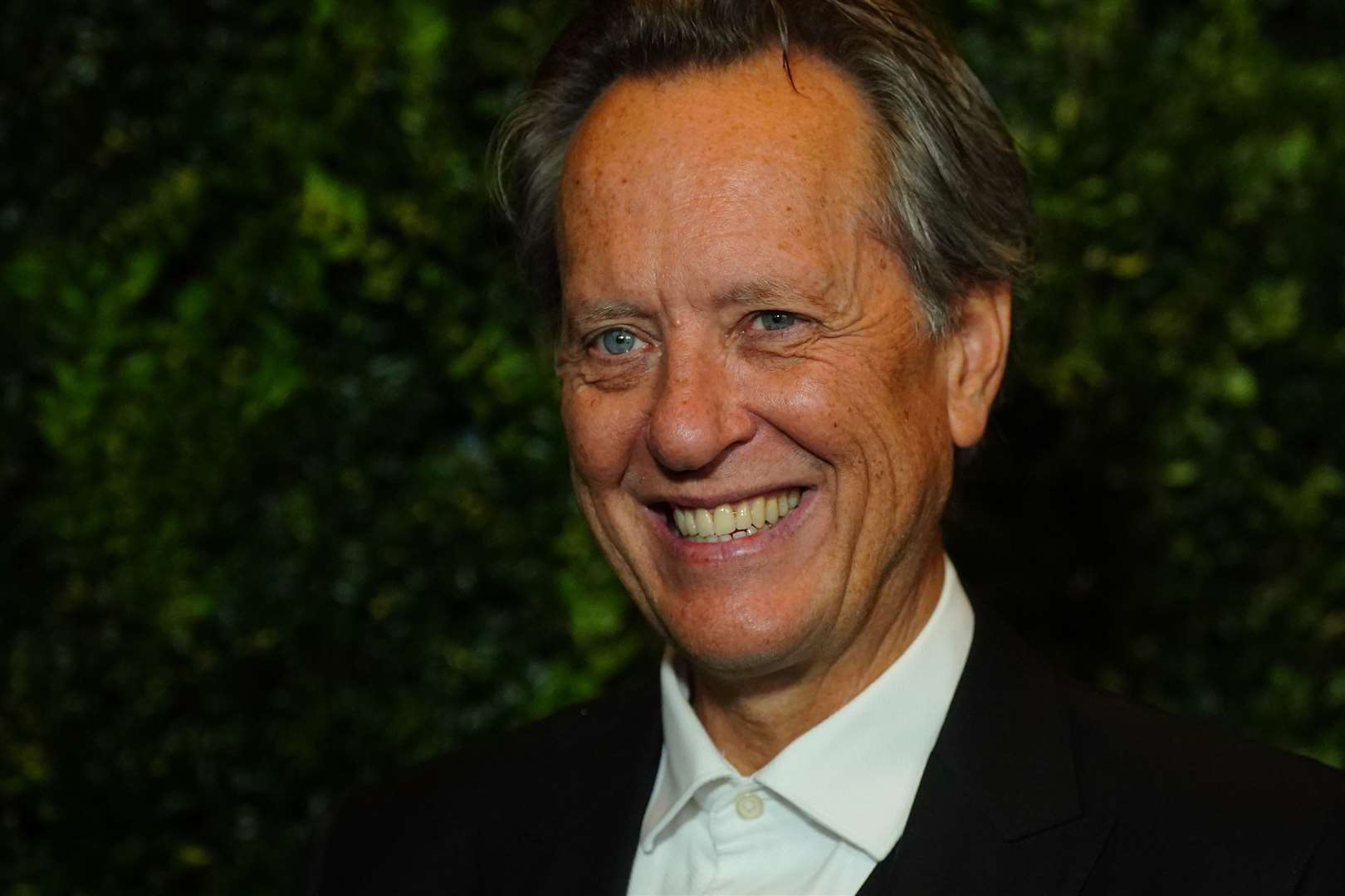 Richard E Grant attended the Bafta red carpet where his film, Saltburn, is nominated for the Outstanding British Film award (Victoria Jones/PA)