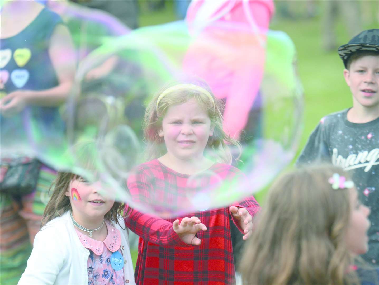 Inverness Highland Games 2018 at Bught Park. Lola Bell Wilkie fascinated by giant bubbles. Picture: Gary Anthony