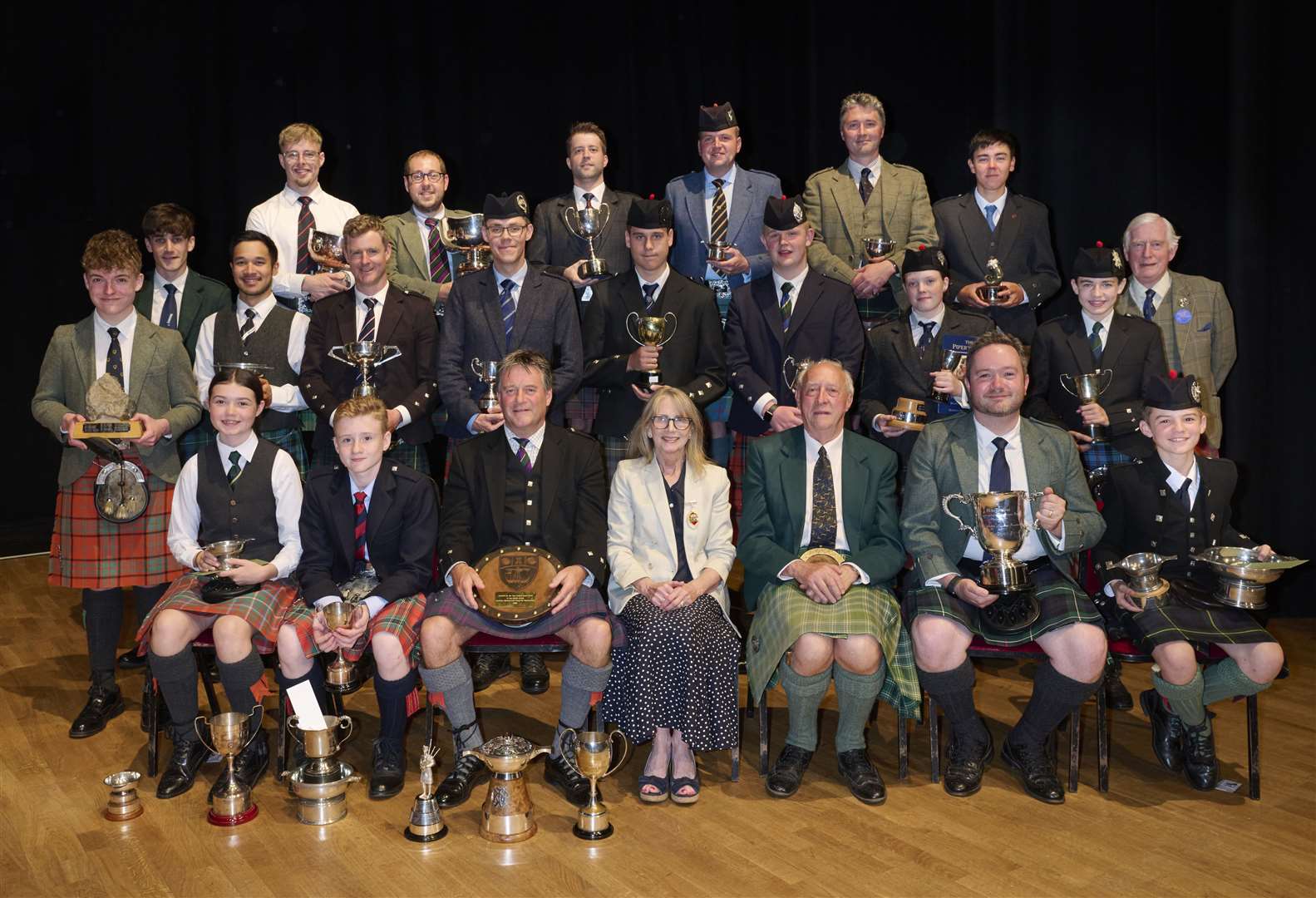 Group photo featuring the Provost, Lord Godfrey Macadonald and Chairman NMPC with prize winners.