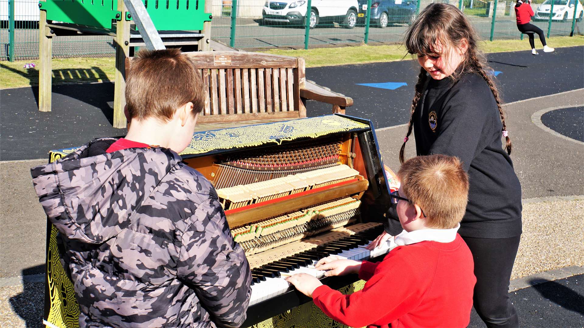 Ryan, Callum and Addison have a go on the piano.