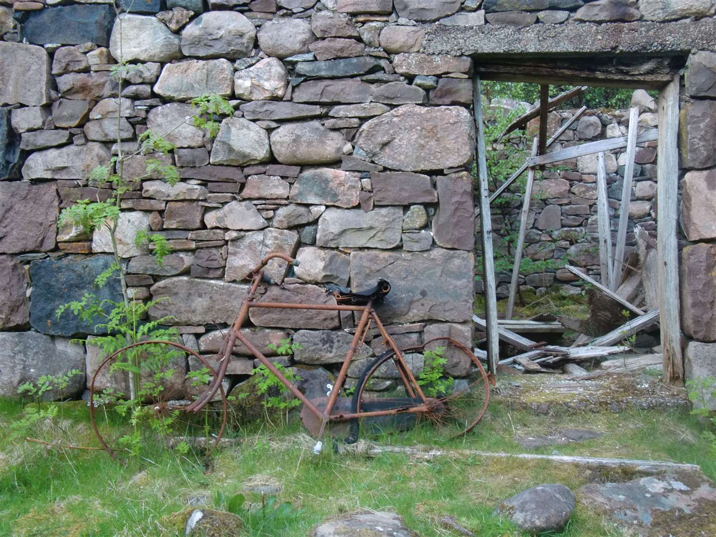 This bike, resting against a derelict building on our return, had seen better days.