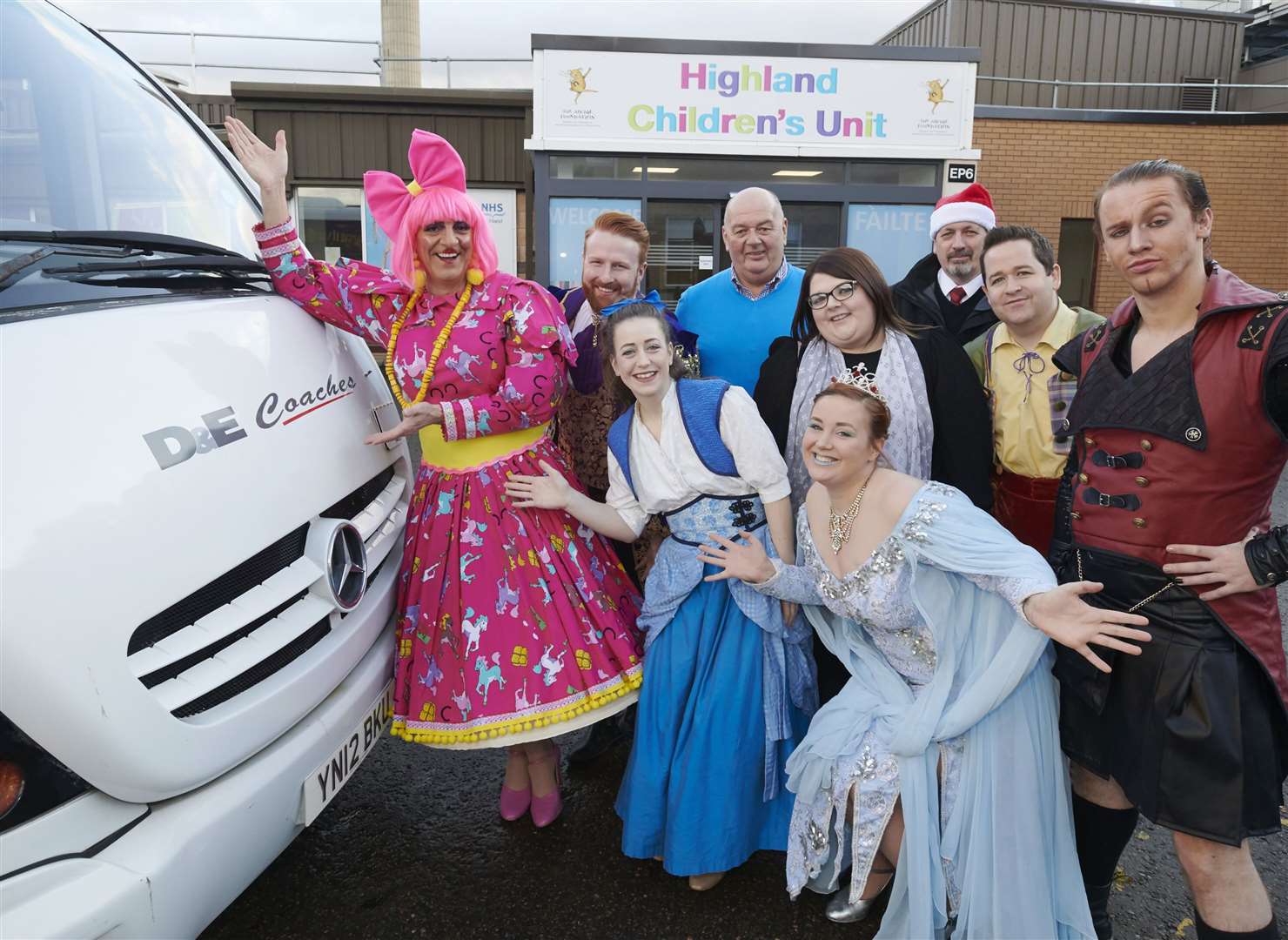 The panto cast, along with D&E managing director Donald Mathieson, arrive at Raigmore Hospital.