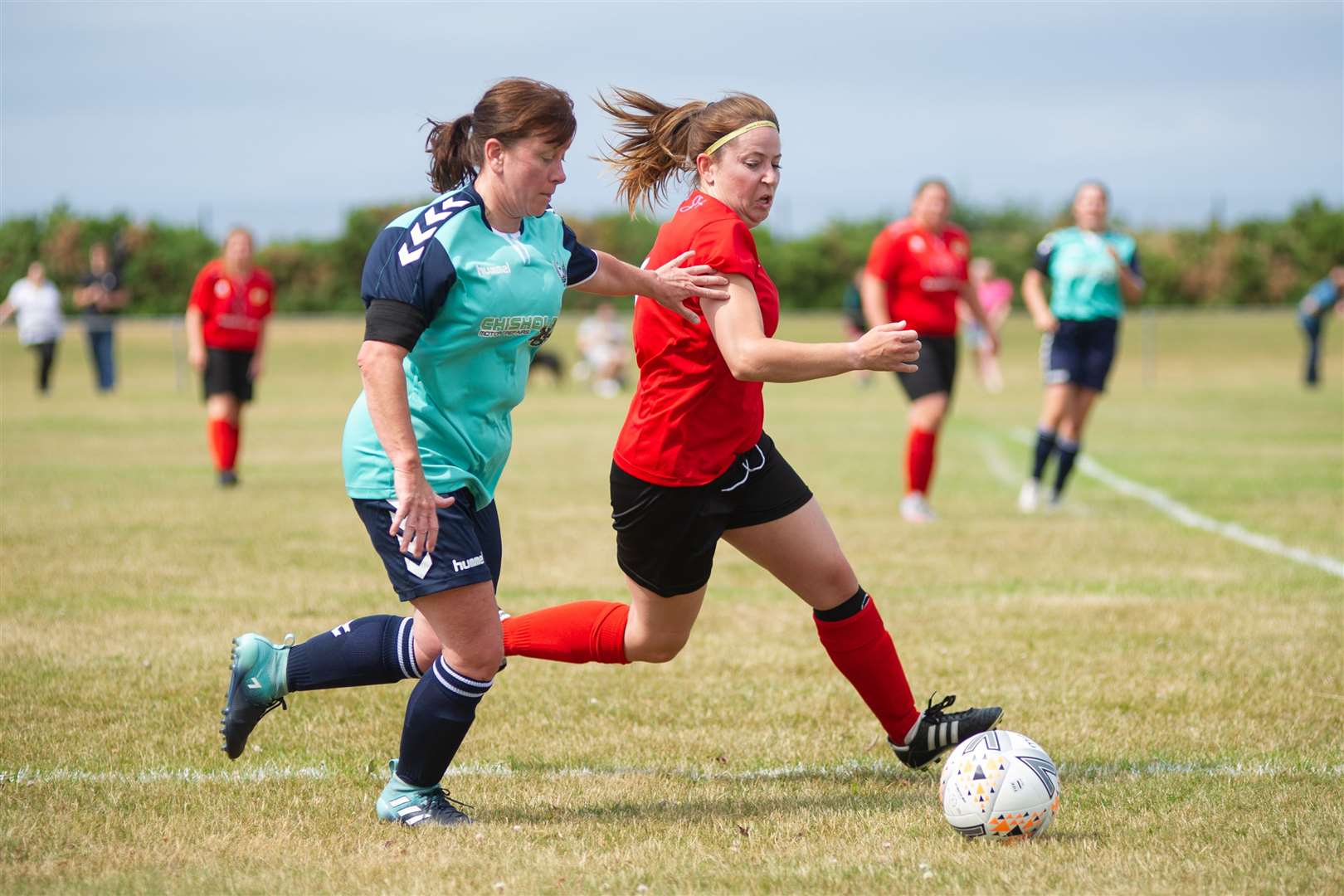 Buckie's Michelle Johnson and Clach's Michaela Munro tussle for the ball. Picture: Daniel Forsyth