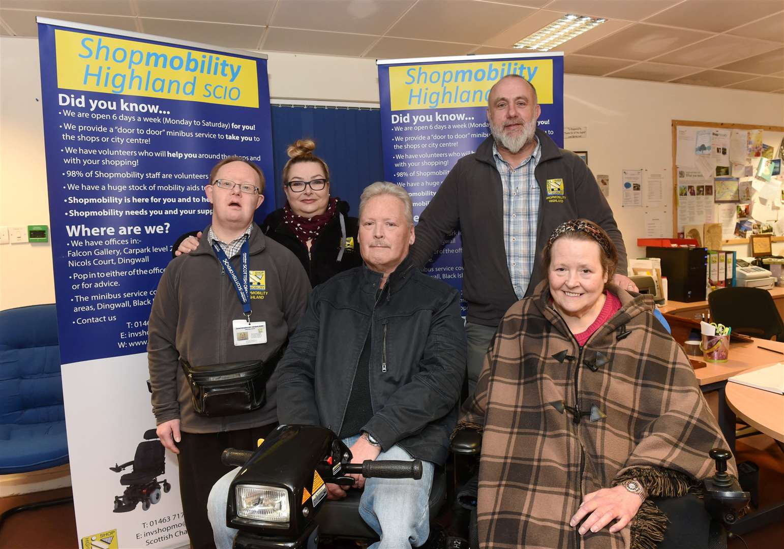 From left: Shopmobility Highland volunteers Richard Davidson, Angela Miller and Paul Williamson, with Norman Macleod and Gale Falconer.