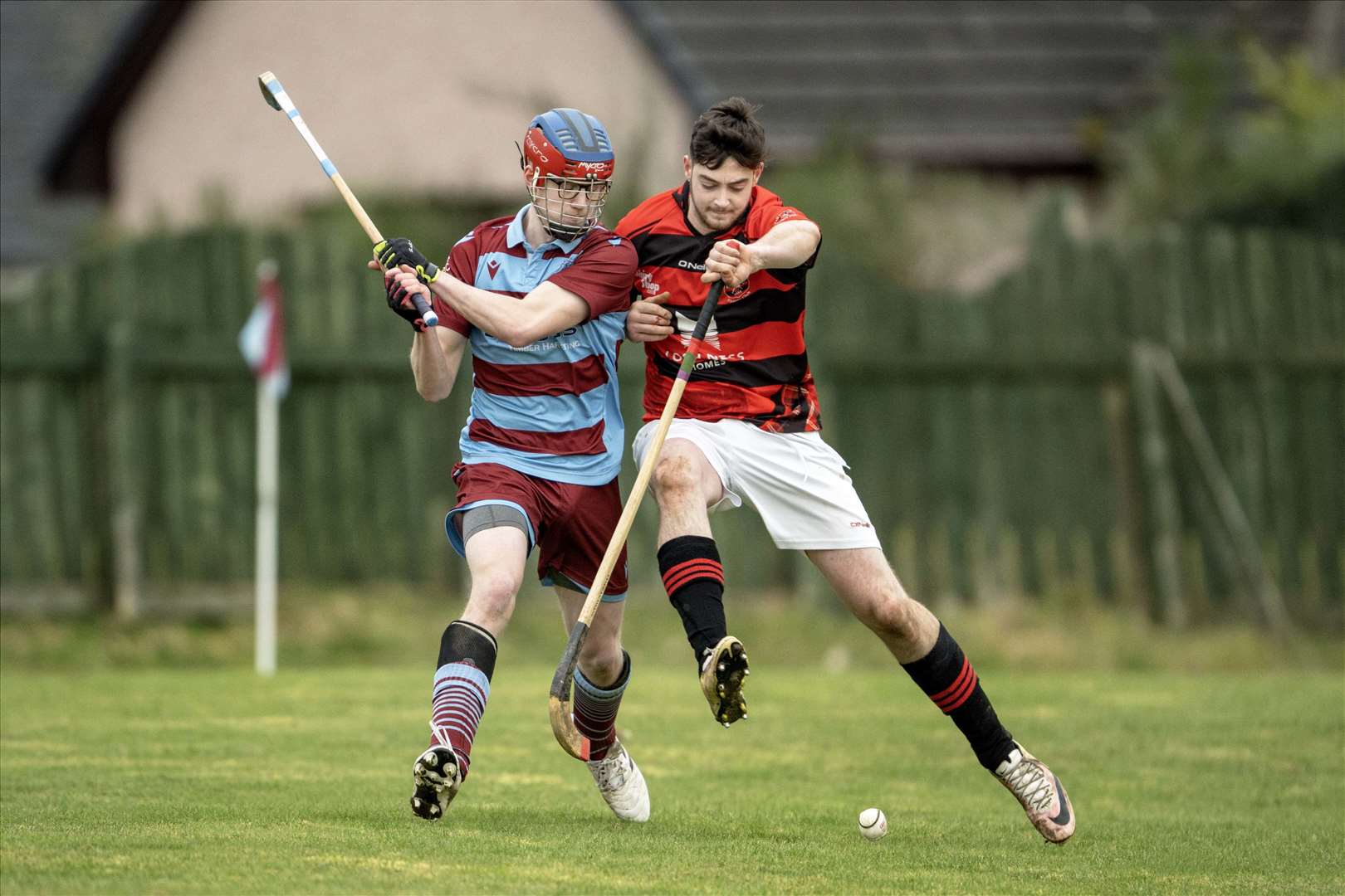 Ruairidh Strachan (Strathglass) is challenged by Lachlan Smith (Glenurquhart). Strathglass v Glenurquhart in the Macdonald Cup pre-season game. Played at Cannich..
