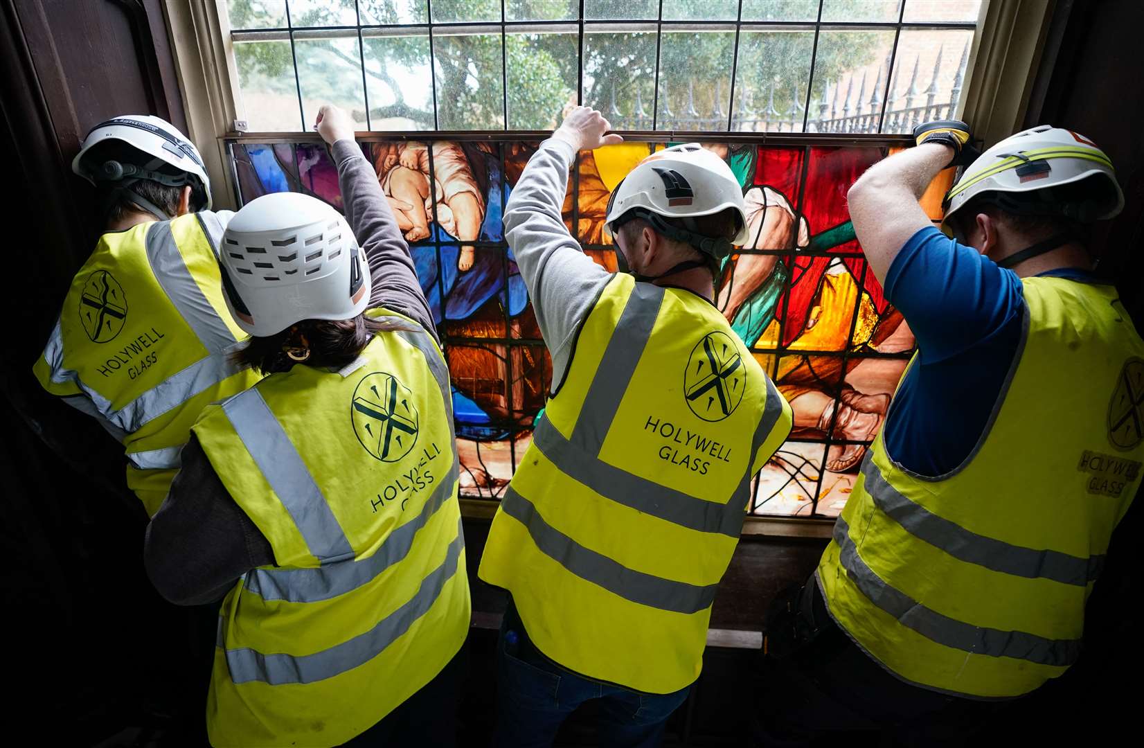 A framed section of the window is installed (Andrew Matthews/PA)