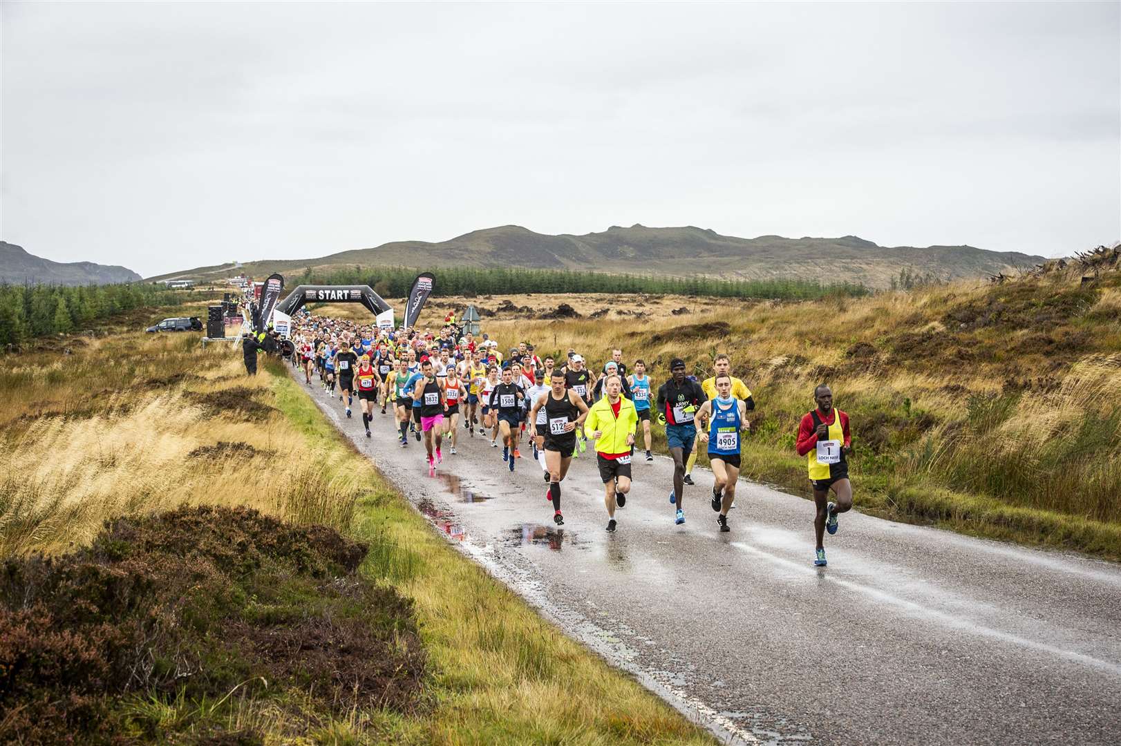 Runners make their way along the road to Whitebridge from the start of the Loch Ness Marathon.