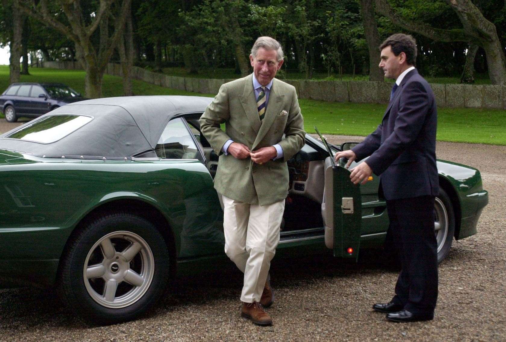 The King with an Aston Martin Volante (PA)