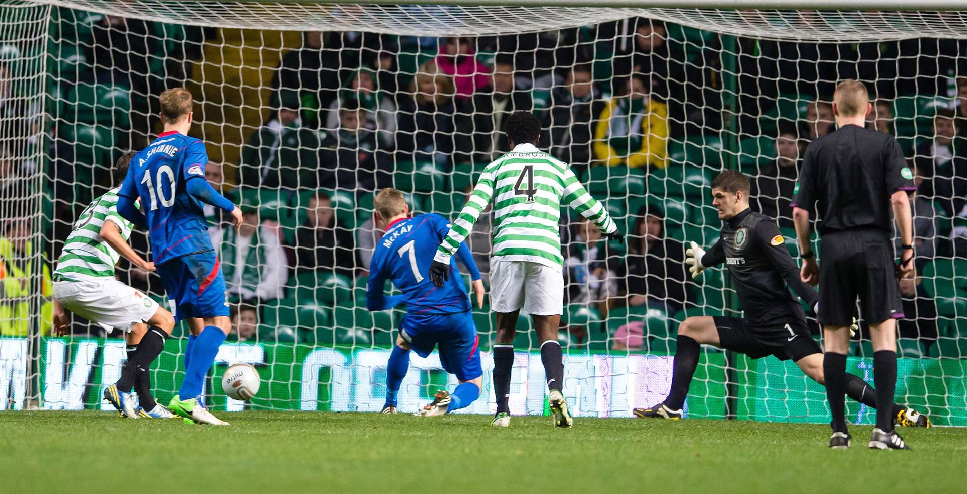 Billy McKay scores the winning goal against Celtic with Andrew Shinnie in November 2012. Picture Ken Macpherson