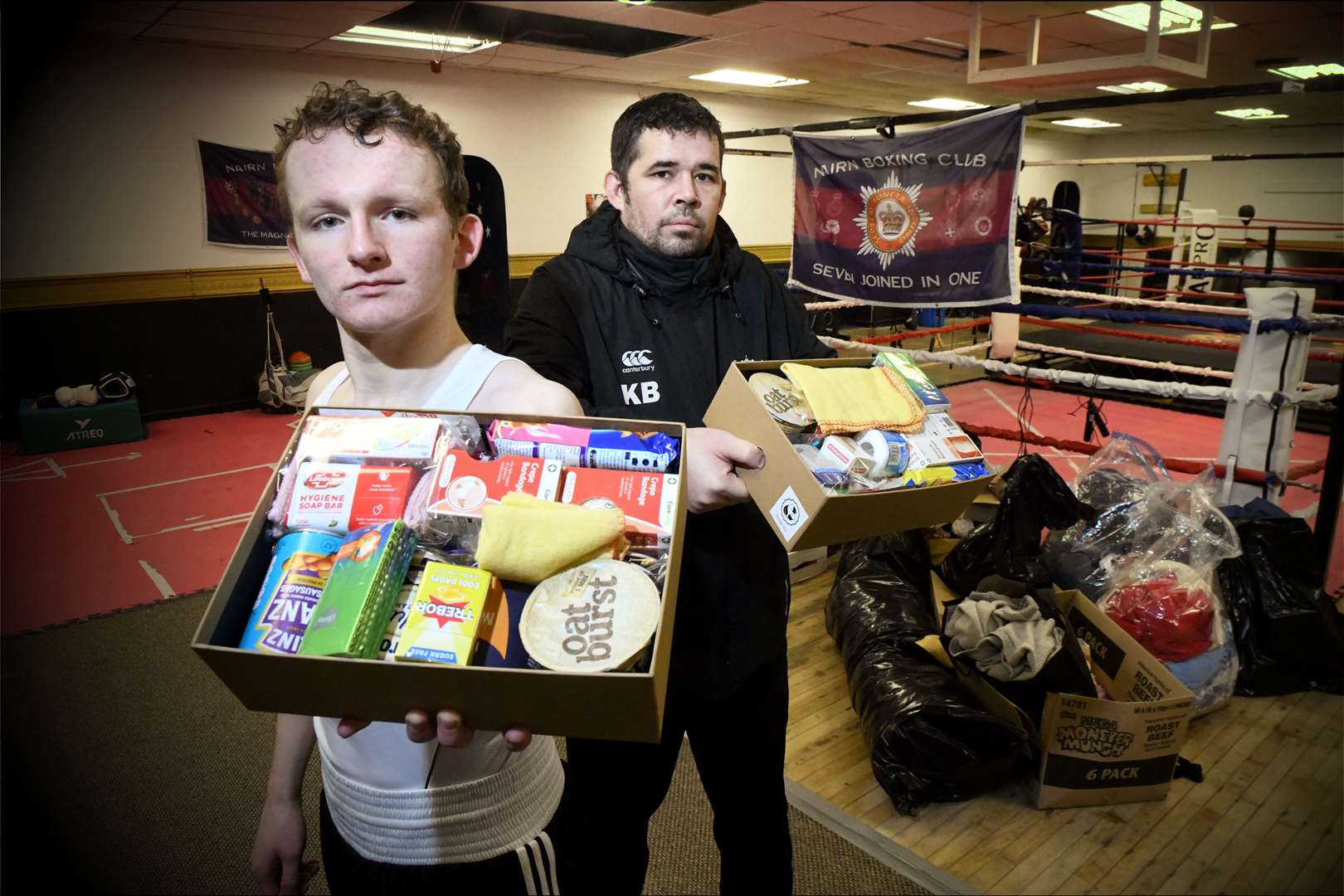 Kevin Brooks, ex-Scots Guard who runs Nairn Boxing Club is organising ration boxes for Ukranian front line troops: Conor Walker, Club Captain, Kevin Brooks, Head Coach. Picture: James Mackenzie.