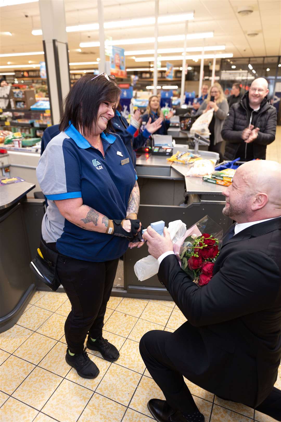 Lynne beaming as Mike gets down on one knee. Picture: AAA