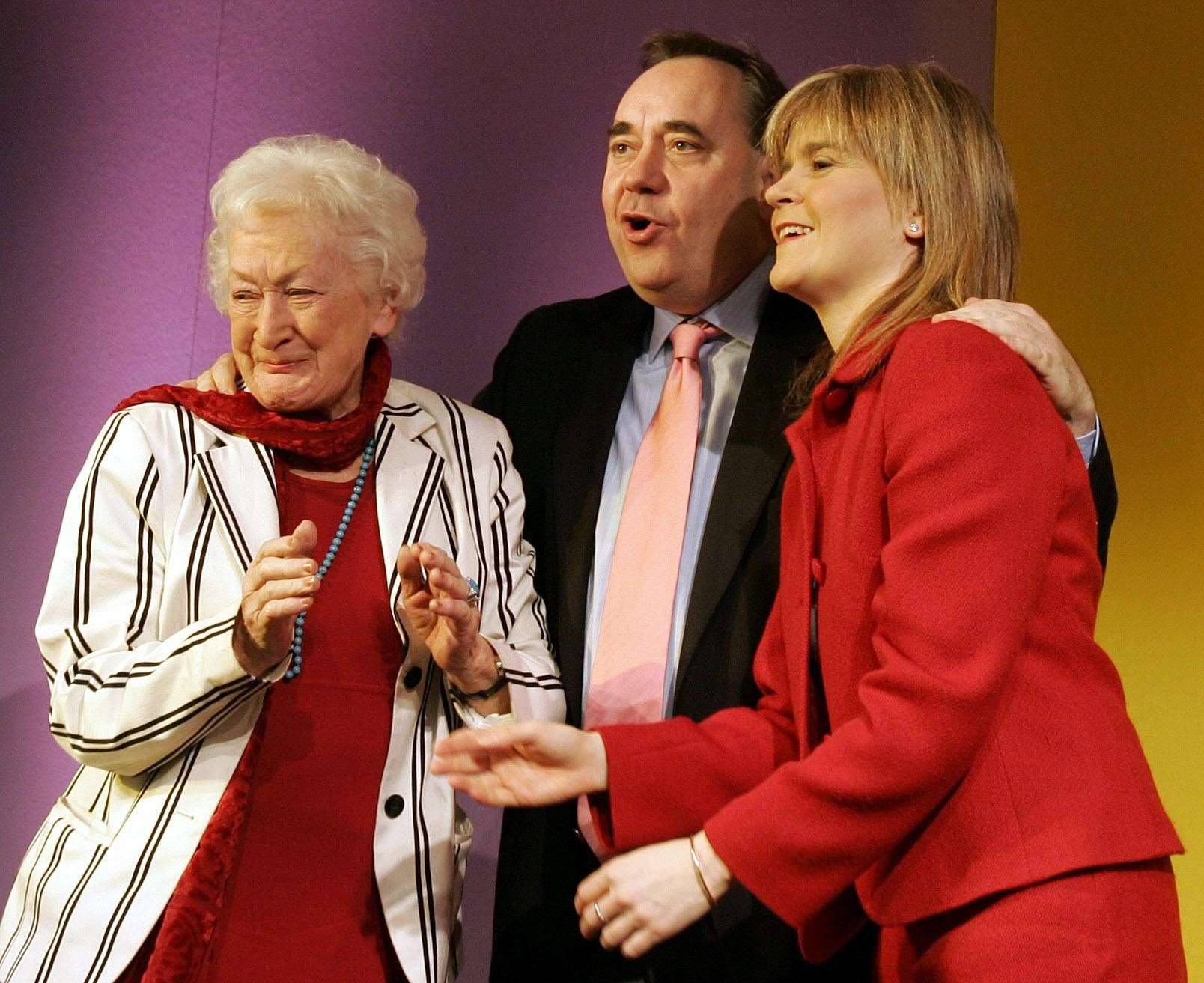 Alex Salmond, pictured with Winnie Ewing, left, and Nicola Sturgeon, led tributes to Mrs Ewing (PA)