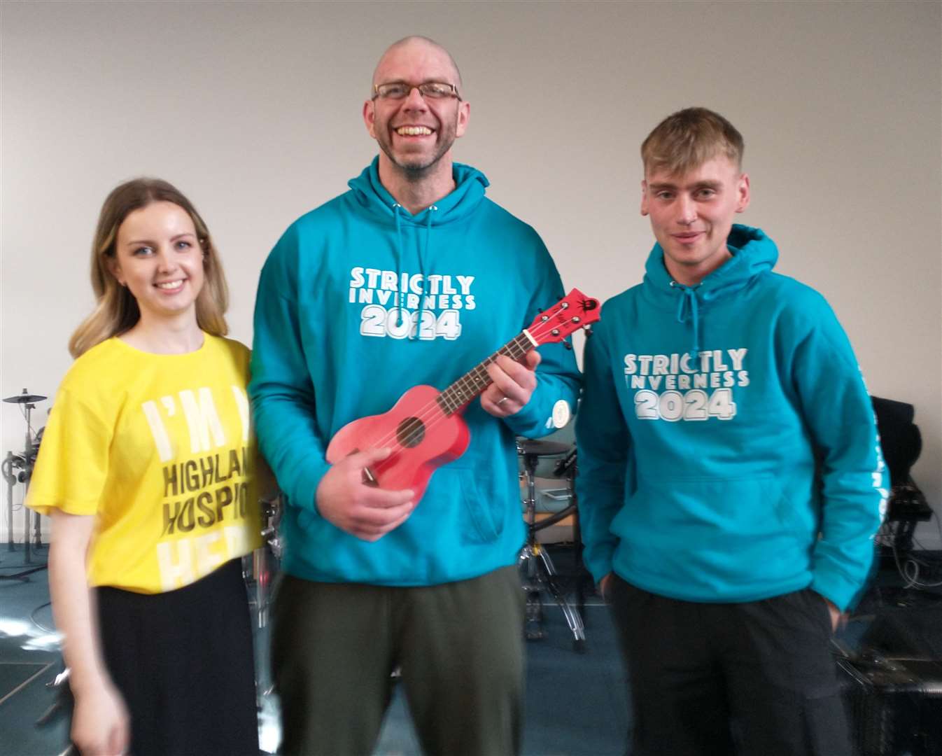 Kenna Ross, Andy Dixon (with a ukulele won in a lucky numbers game) and Shaun Rose, at a talent show for local youngsters.