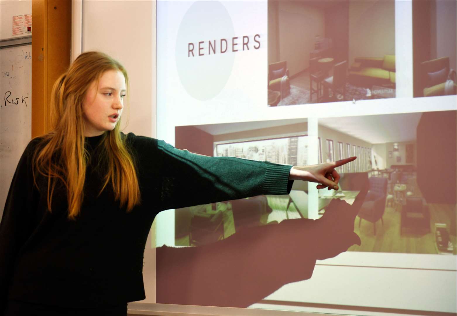 Orin Gaukroger showing the renders of what the building she designed would look like on the inside. Picture: James Mackenzie