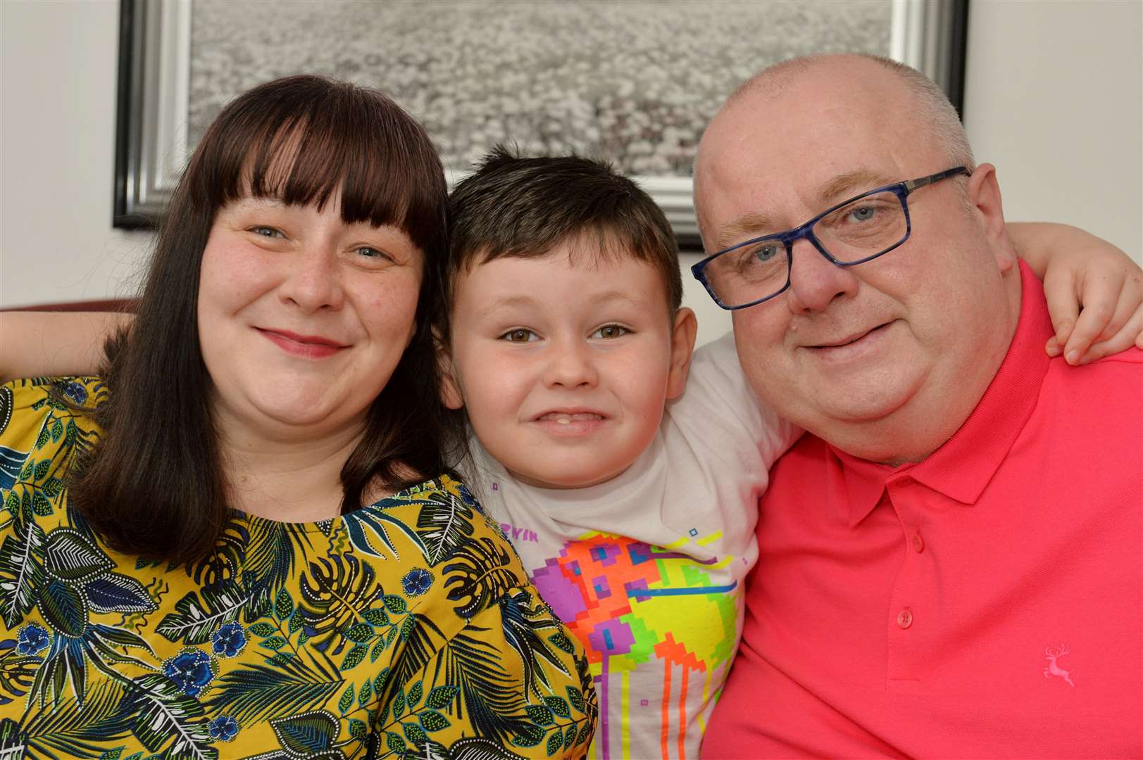 Riley MacLennan with mum and dad Moria and Kevin after he was declared free of cancer last year. Picture: Callum Mackay