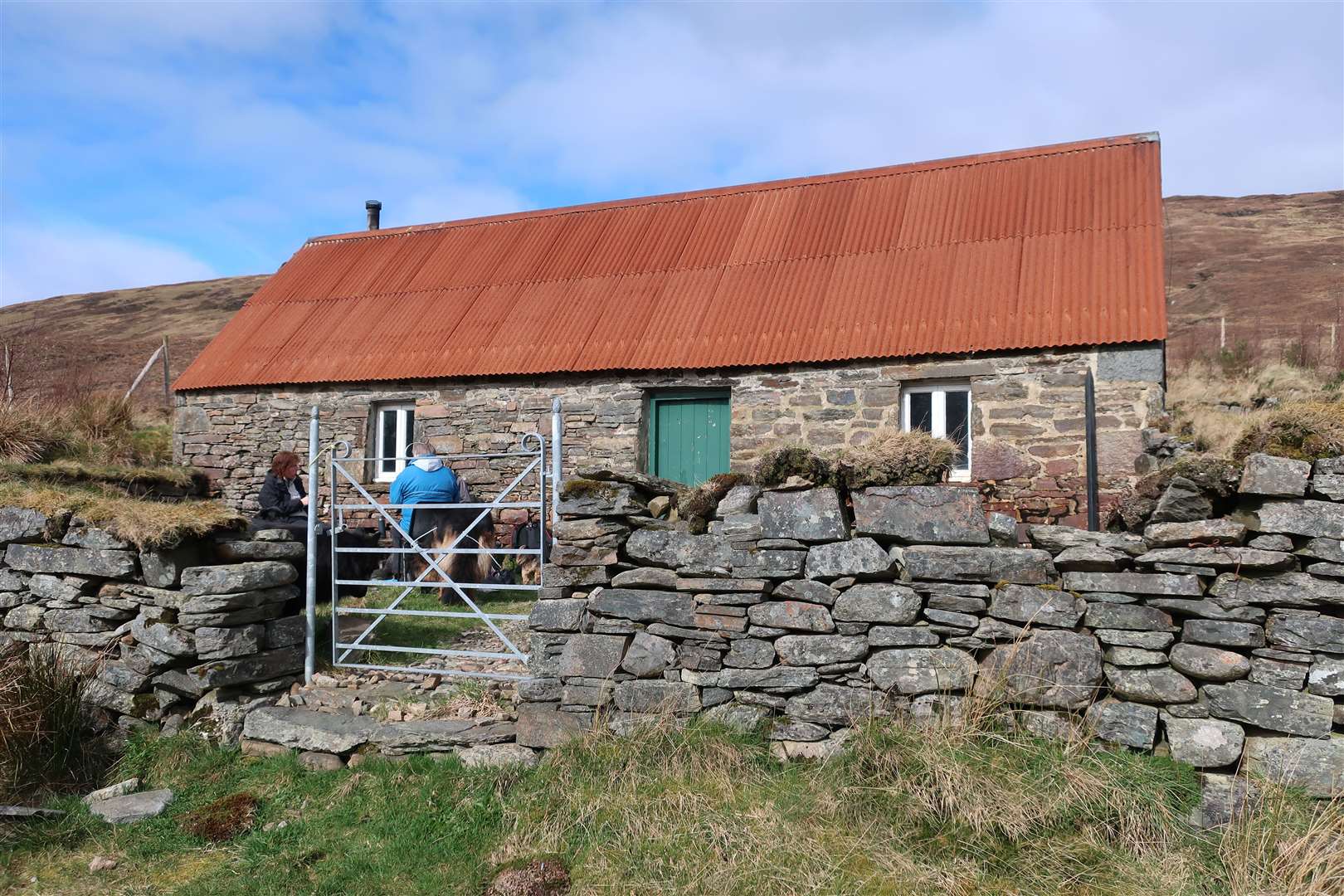 Visitors at Lochinvrraon bothy on the route to Craig Rainich.