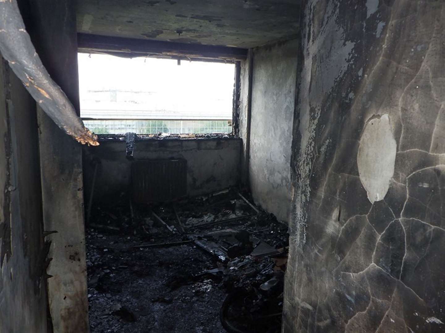 A picture taken from the twitter feed of @LondonFire showing the fire damage inside the flat. (LBF)