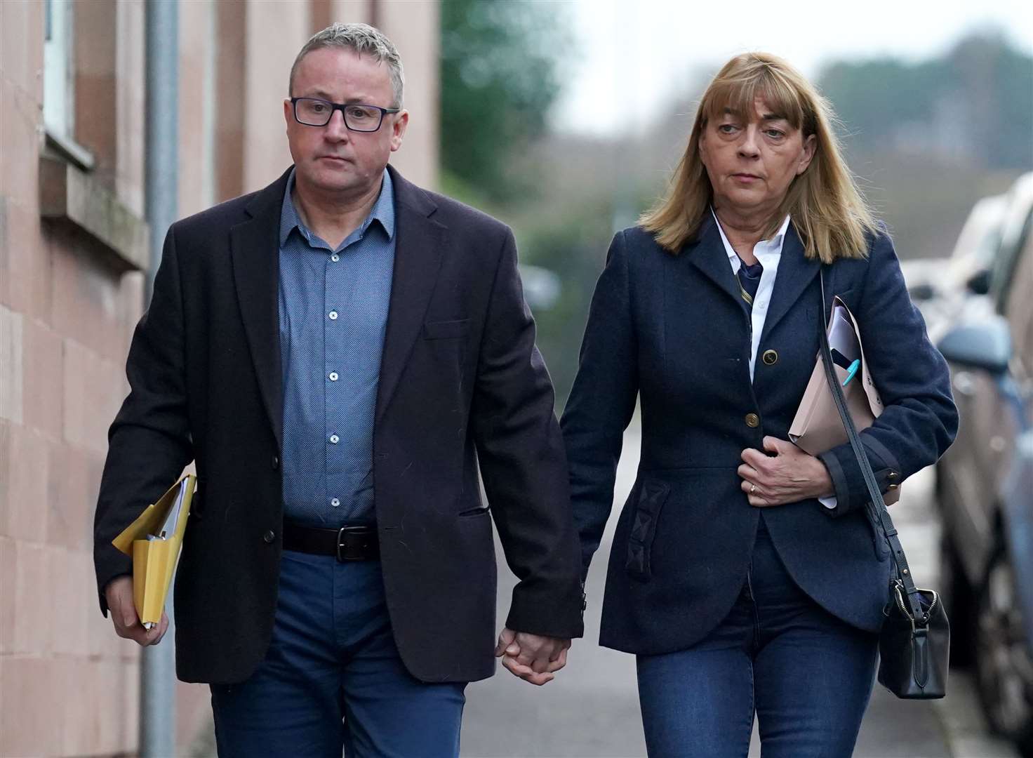 Katie Allan’s parents Linda and Stuart outside the inquiry (PA)