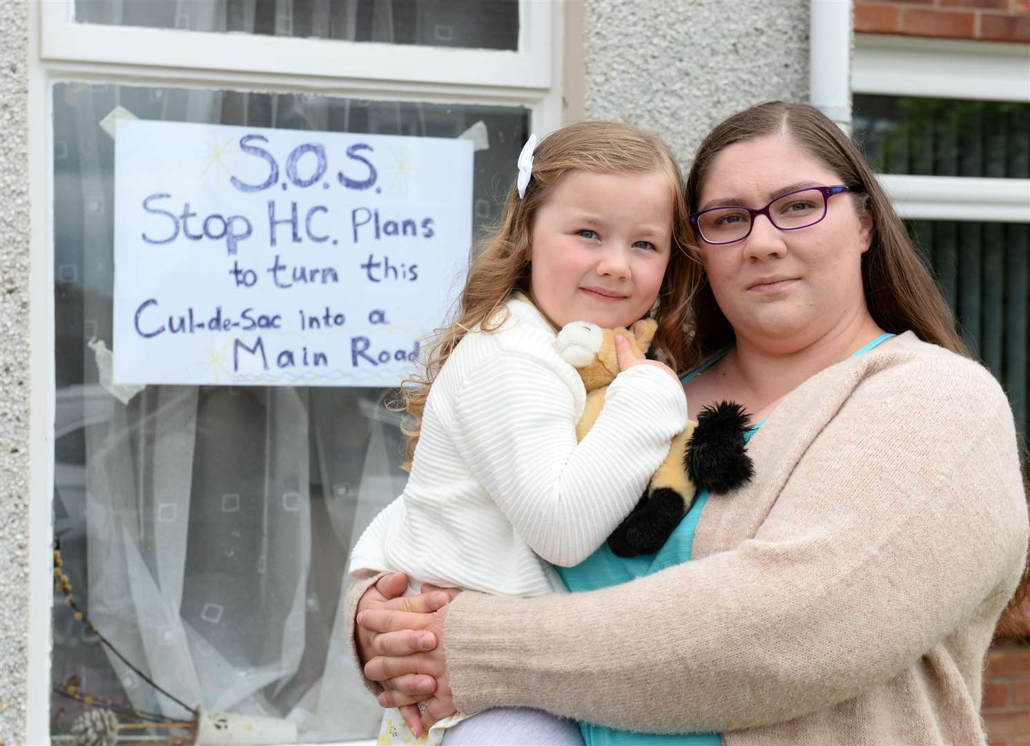 Karyne Walker, with daughter Vada, has started a petition opposing the proposed road.
