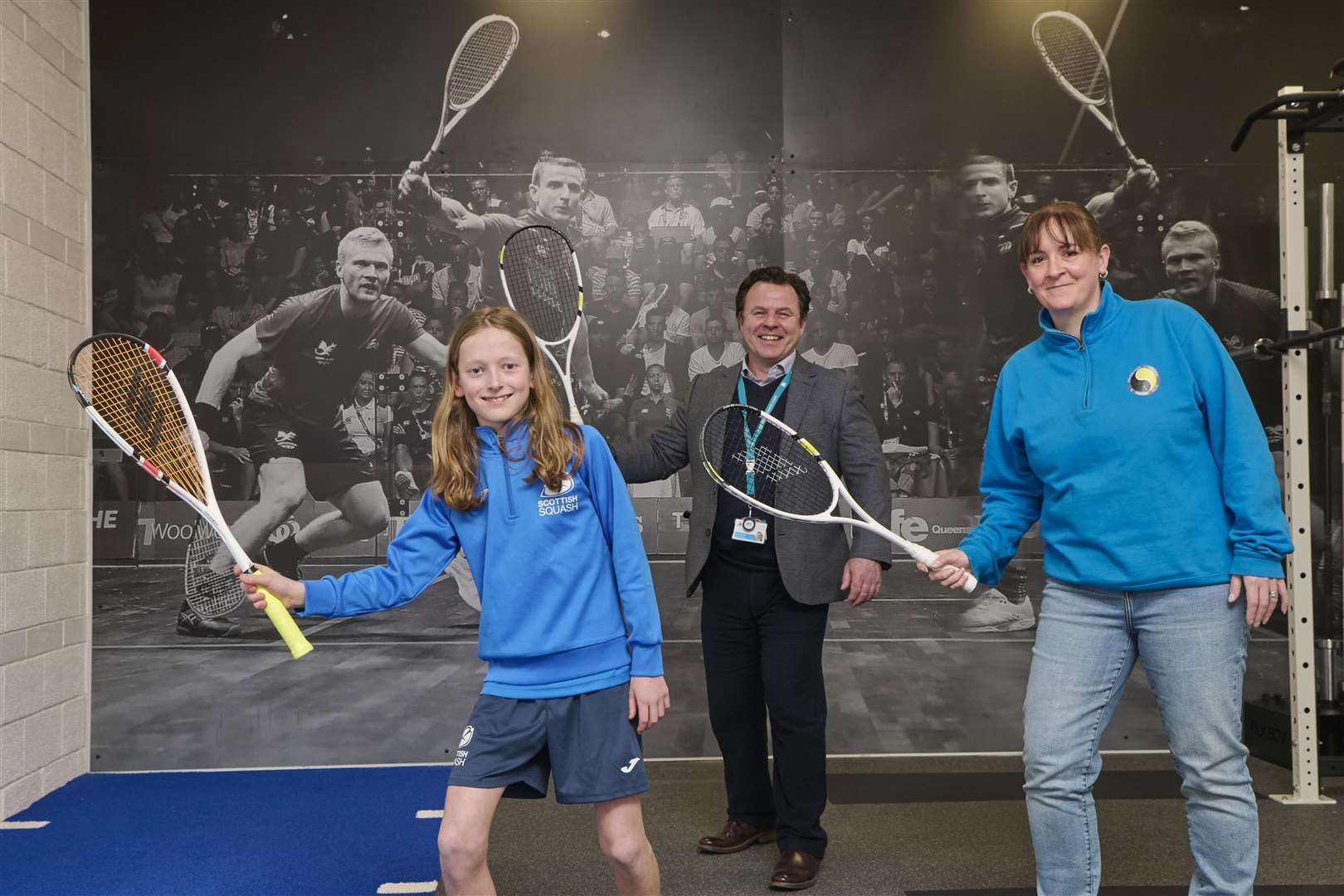 Steve Walsh, chief executive of HLH, with Ailsa Polworth (right) of Inverness Tennis & Squash Club and a young club member