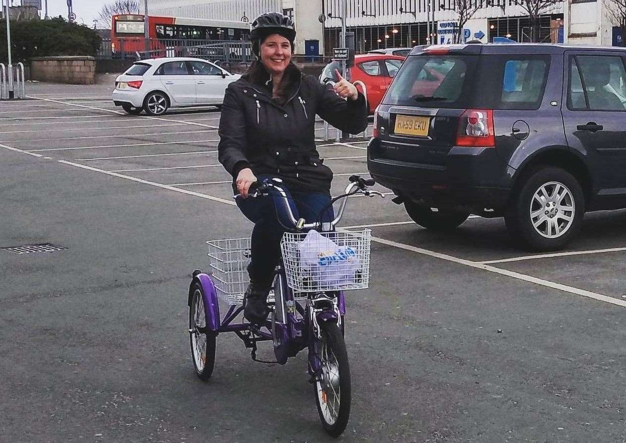 Cllr Emma Roddick on her trike which she uses for food deliveries.