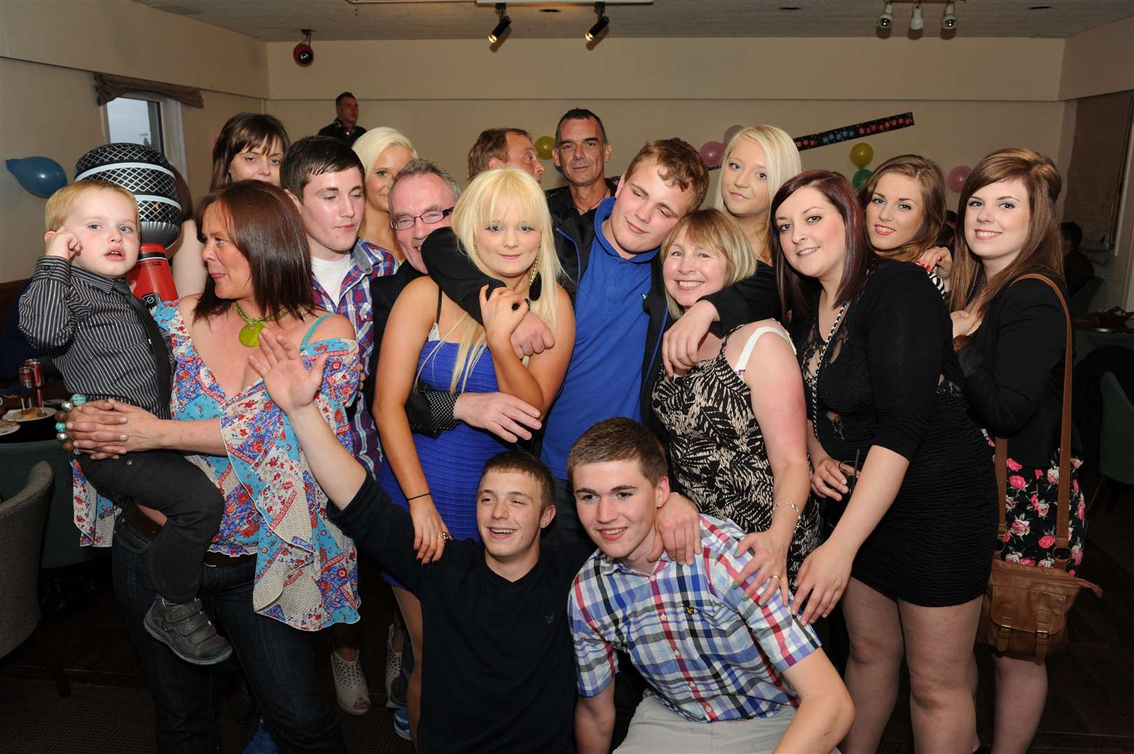 Doneil Esson (centre blue) celebrates his 18th with party at the Masonic Club with friends and family