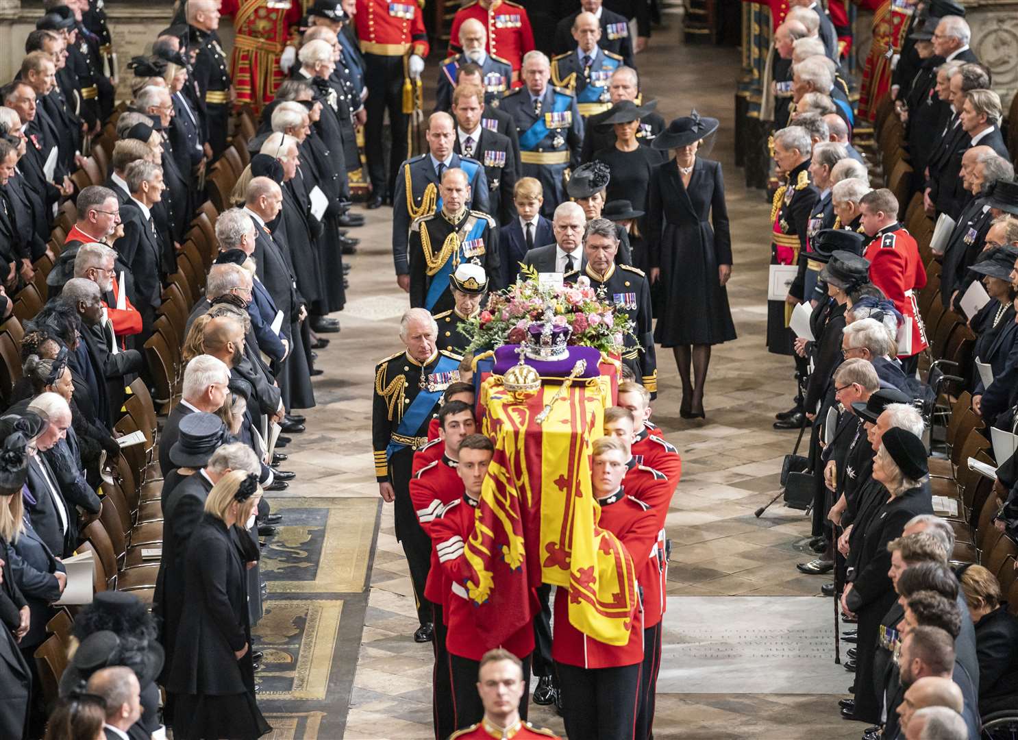 The King leads the royal family behind the late Queen’s coffin in Westminster Abbey (Danny Lawson/PA)