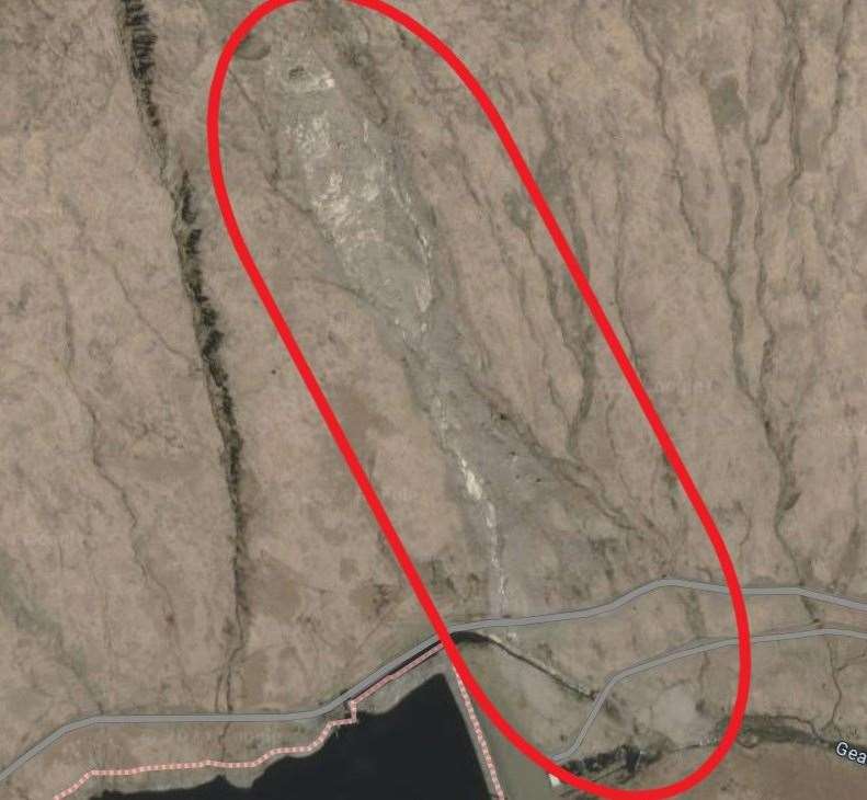 The scar from the landslide (circled red) is clearly visible in Google Earth images of the hillside. Picture: Google maps.