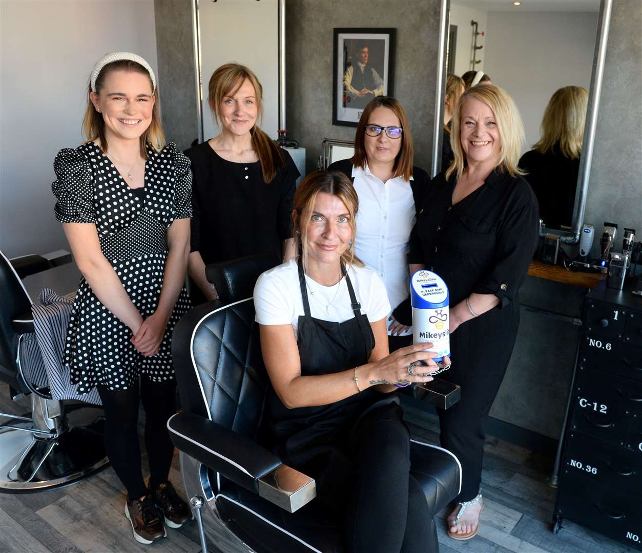 New opening TM Barbers on Tomnahurich Street will donate a pound to Mikeysline with every haircut.Owner Tracy Morris(centre) with Samantha Gill,Lisa Clark,Kerry Thomas and Teresa Fyffe.Picture Gary Anthony.