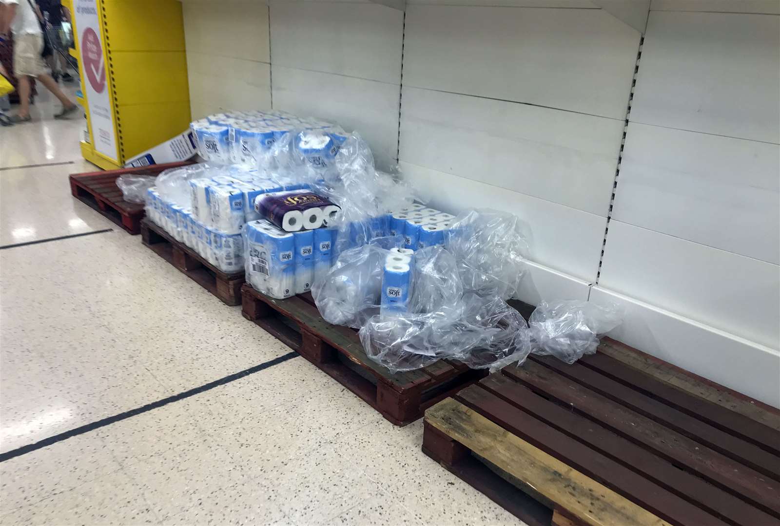 Depleted stocks and empty pallets in the toilet roll aisle at the Portsmouth North Harbour Tesco on Monday (Steve Parsons/PA)