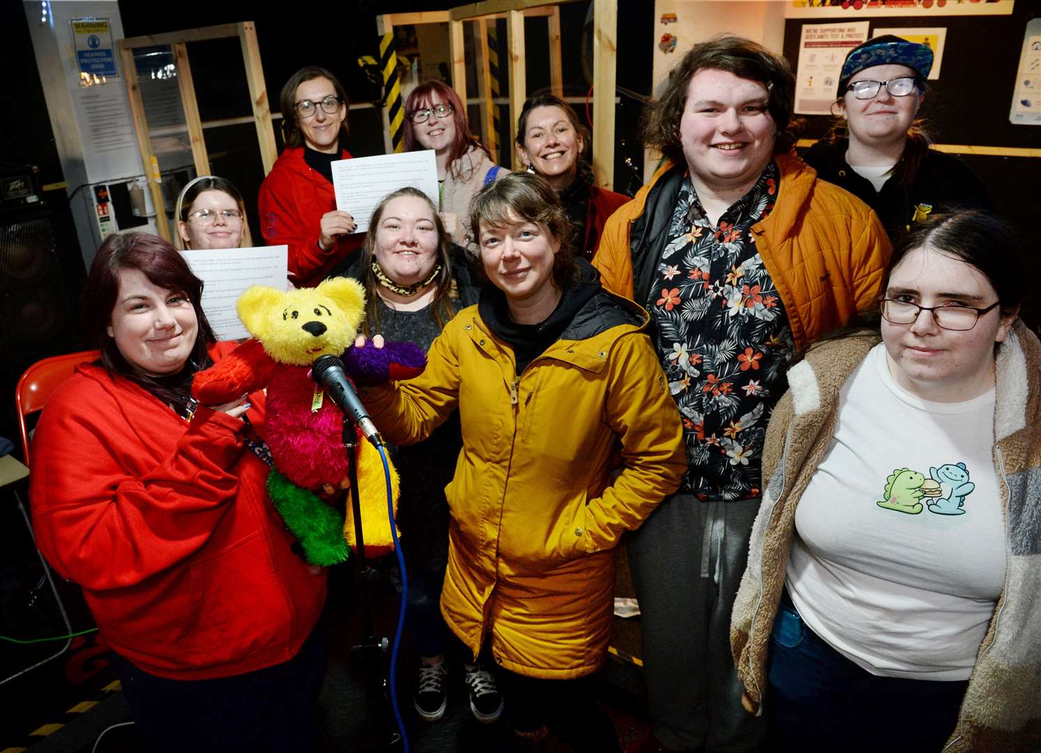 The authors from Inspiring Young Voices join poet Jen Hadfield (centre) at the Music Shed in Inverness to record Angus's First Day at School.