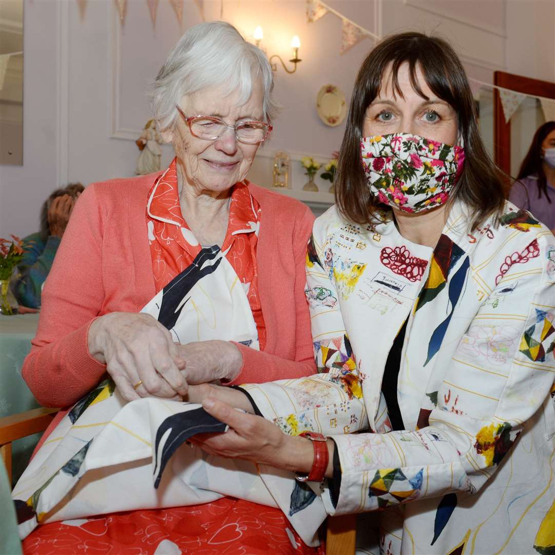 Fenella Kerr and mother Brenda Kerr wearing the napkin that she helped to design. Pictures: Gary Anthony