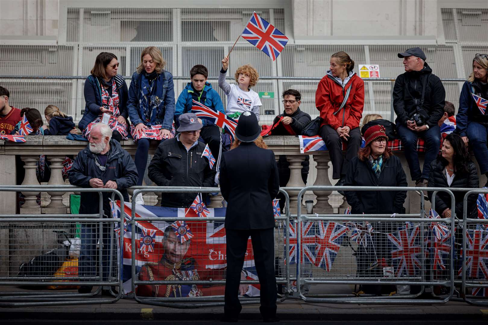 A boy waves a Union flag on Whitehall (Rob Pinney/PA)