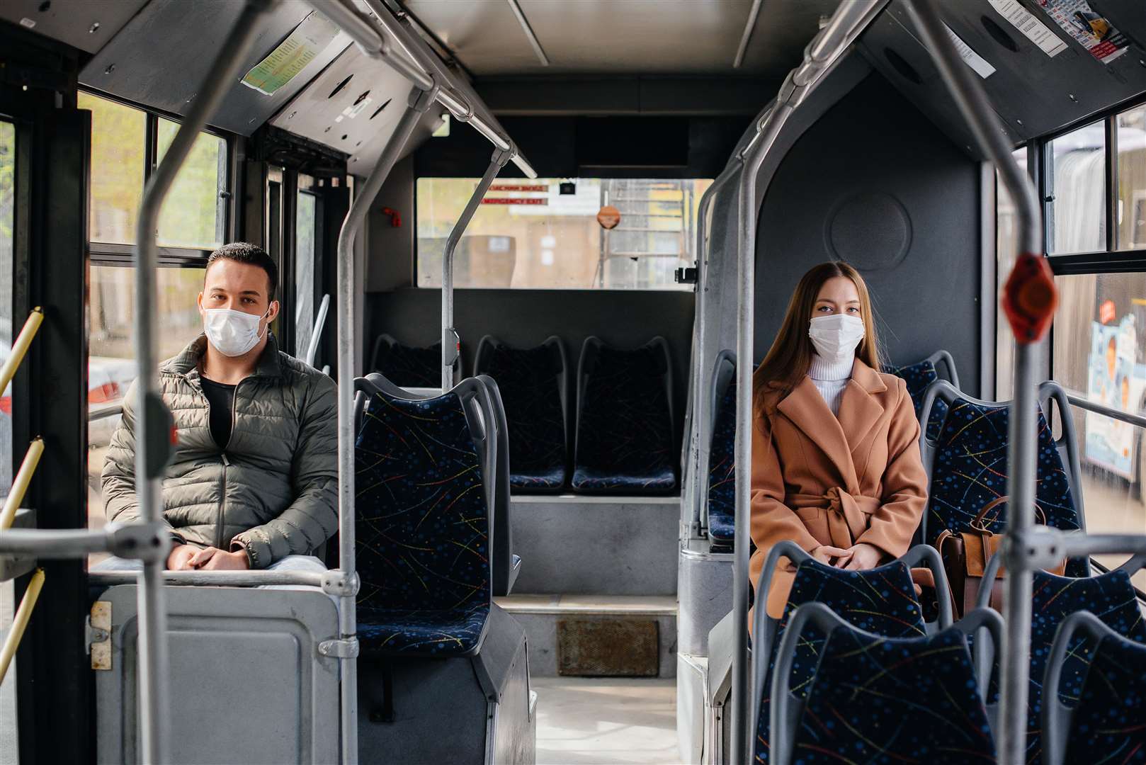 Passengers on public transport during the coronavirus pandemic keep their distance from each other.