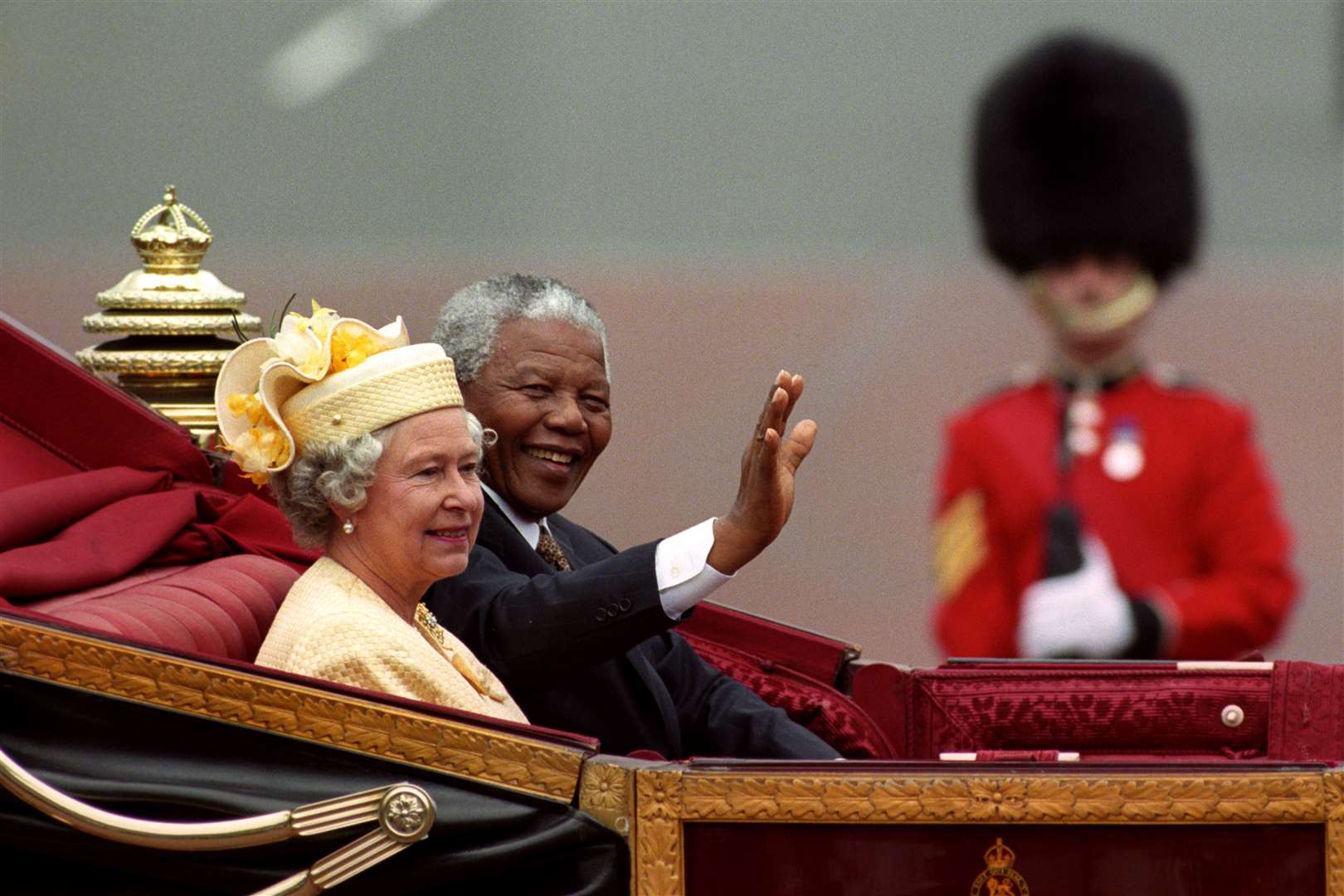 South African President Nelson Mandela and the Queen ride in a carriage along the Mall during his state visit to the UK in 1996 (David Cheskin/PA)