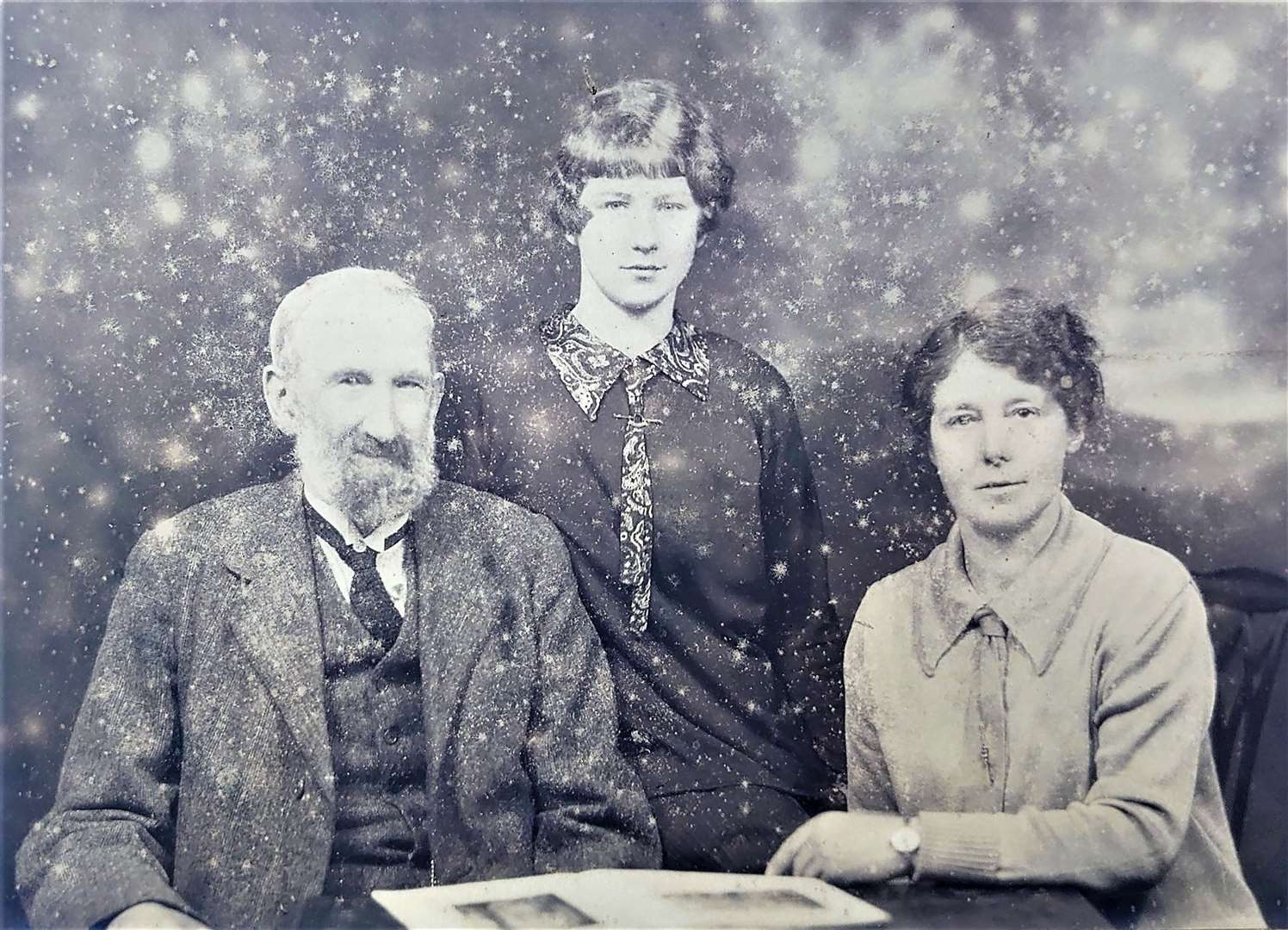 Group photograph, possibly showing Isabella and her parents.