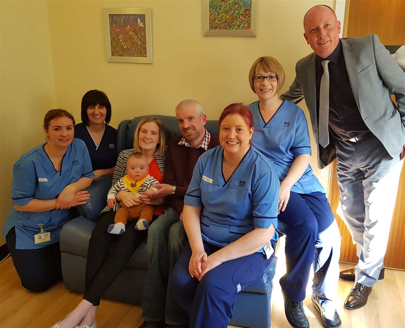 Hannah and Robert Toohill with son Fraser, Chris Smith (right) and baby unit staff.