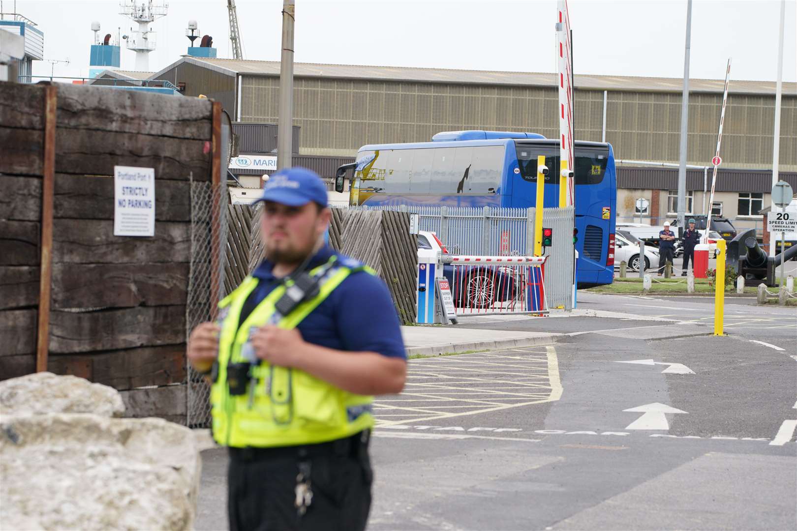 A coach believed to be carrying asylum seekers arrives at Portland Port in Dorset (Ben Birchall/PA)