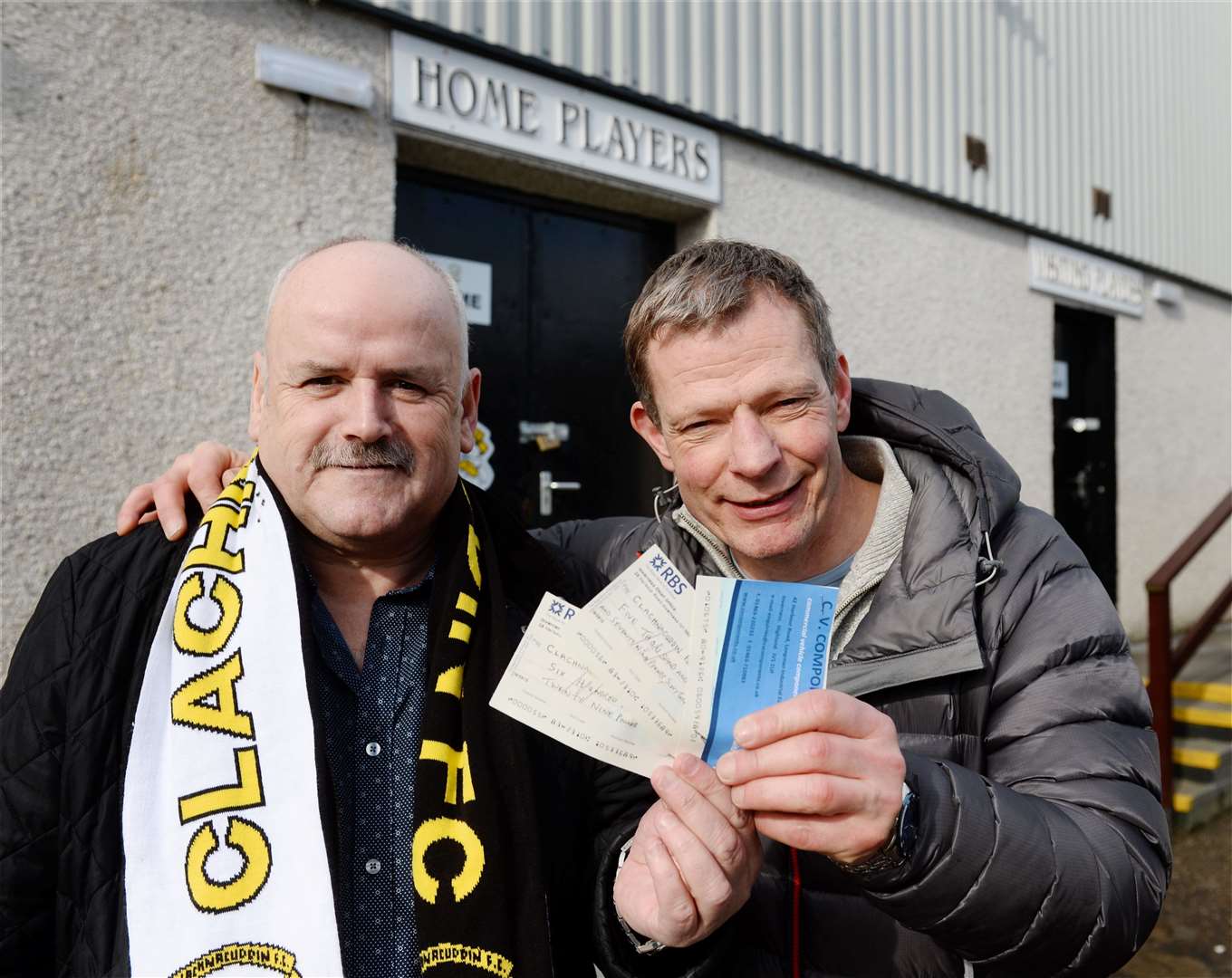 Clachnacuddin manager Sandy McLeod receives funds raised by Clach fans from Billy Corbett. Picture: Gary Anthony