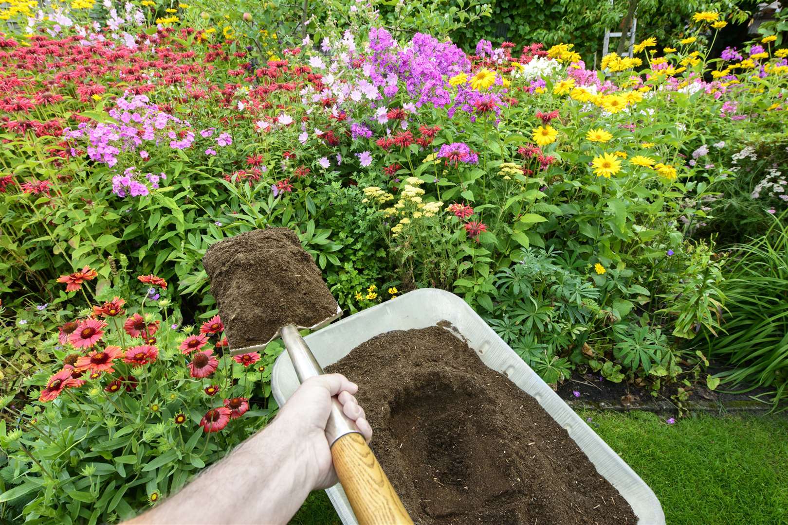 Use your own compost mix to flower beds bloom. Picture: iStock/PA