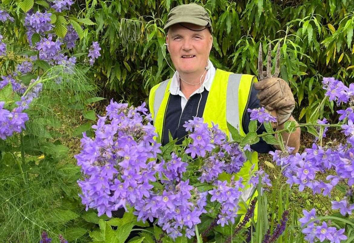 John Walmsley happy at his voluntary work in the UHI Inverness gardens.